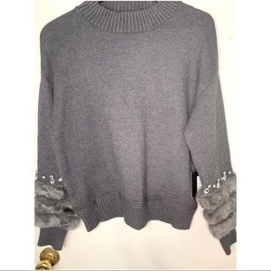 Grey sweater with fur and jeweled sleeves
